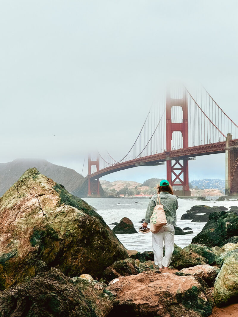 Travel nurse standing in front of the Golden Gate Bridge in San Francisco