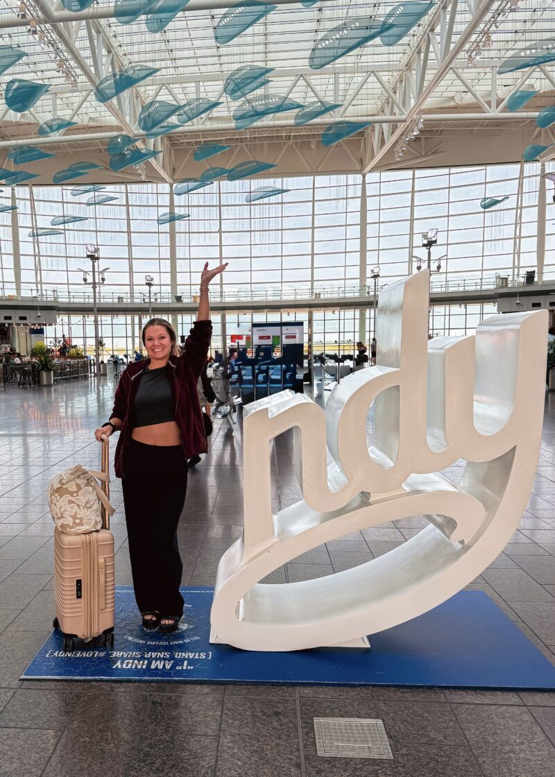 midwest girl standing at Indianapolis International Airport